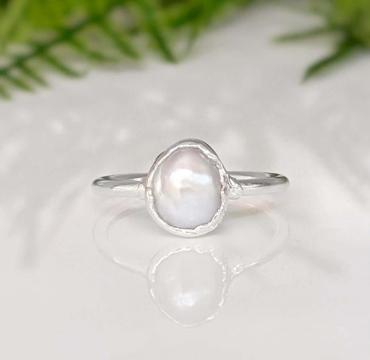Classic solitaire freshwater pearl ring on sterling silver band, featuring a creamy-white Keshi pearl, ideal for gifts.