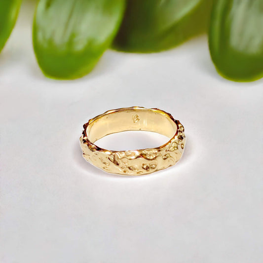 Handcrafted molten gold textured wedding ring, showcasing rustic elegance and organic beauty.