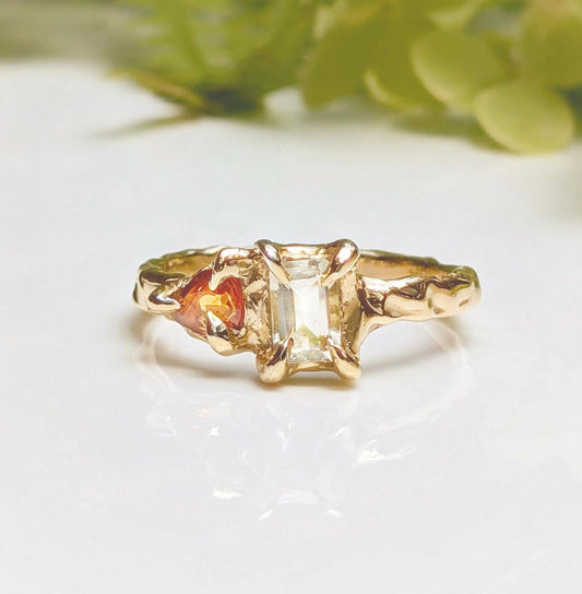 Heliodor and Orange Sapphire ring in Solid 14k Gold, featuring a radiant cut Heliodor and pear shaped Orange Sapphire.