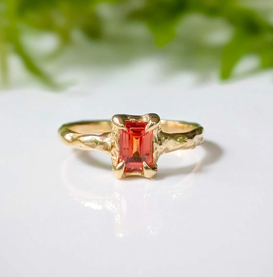 Unique handcrafted orange sapphire ring in solid 14k gold with textured band, perfect for engagement or special gift.