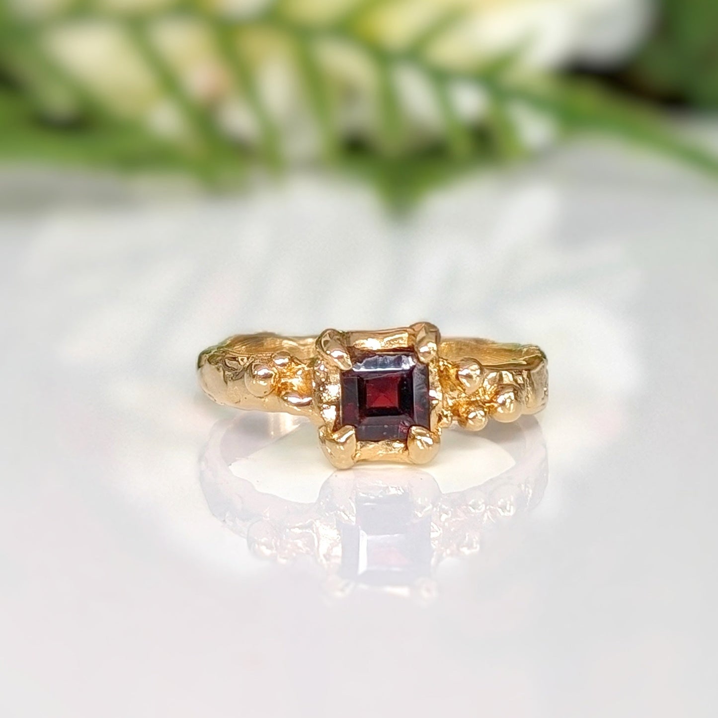 Square cut Red Garnet engagement ring in solid sterling silver with an organic textured band for a unique charm.
