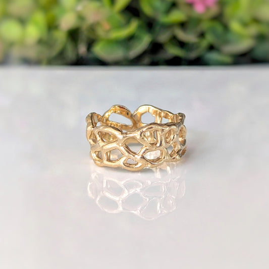 Molten Gold Honeycomb ring in solid 14k gold with unique abstract design, reflecting liquid metal elegance.