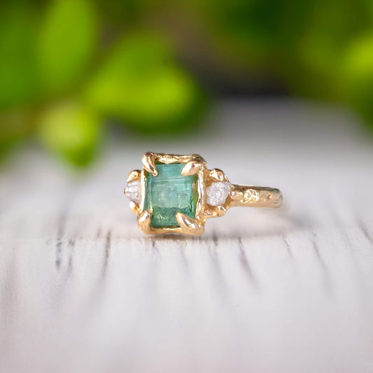 Raw mint green Emerald and diamonds set on Molten Gold prong setting