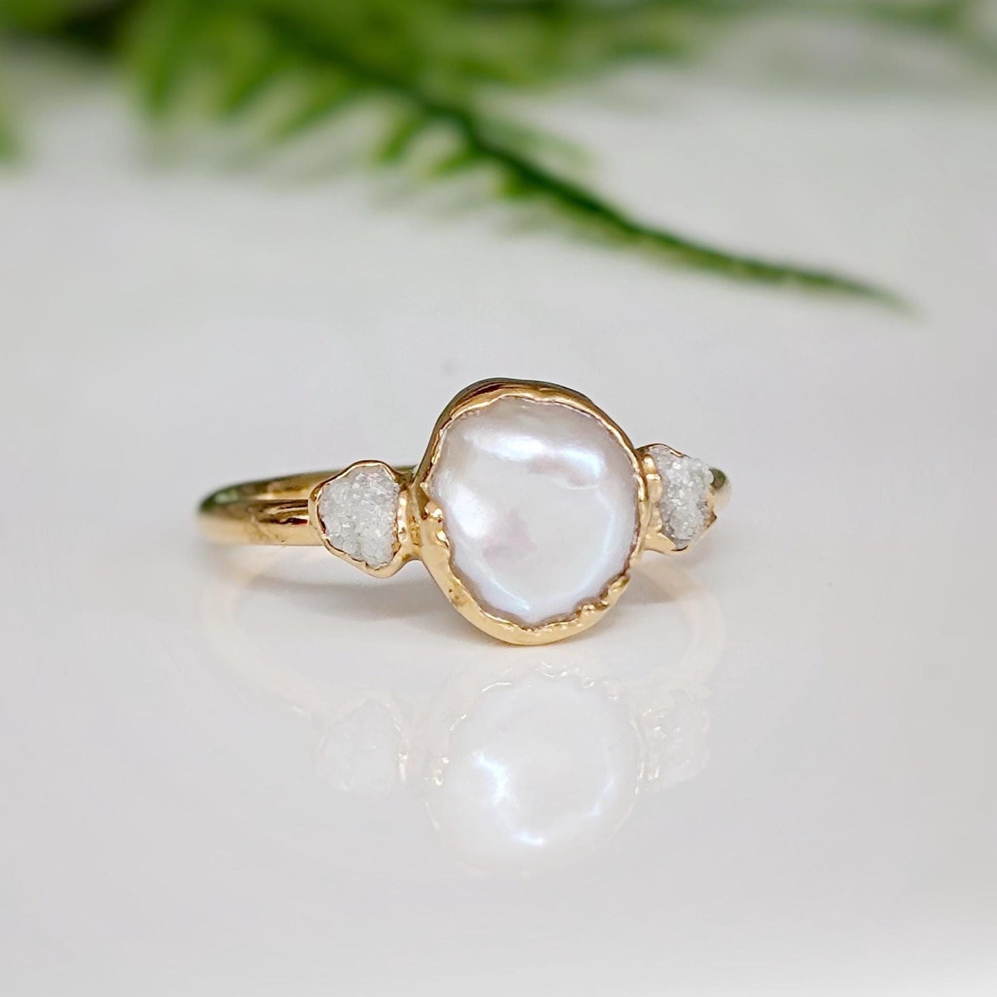 Freshwater pearl and raw diamond wedding ring set with gold band, showcasing romantic elegance.