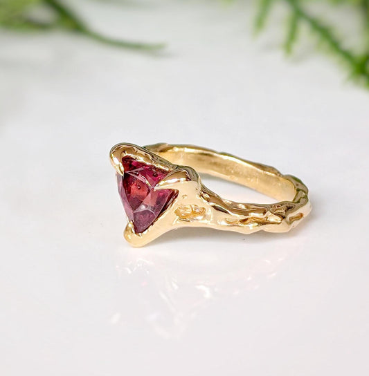 Handcrafted Rubellite Tourmaline ring in solid 14k gold with an organic textured band.