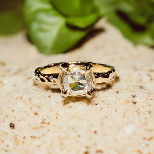 Gold Moissanite textured engagement ring featuring an 8mm cushion cut gemstone, beautifully set in solid 14k gold.
