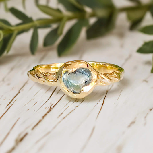 Teal Australian Sapphire ring in solid 14k gold from the "Pea in a Pod" collection, featuring a textured band.