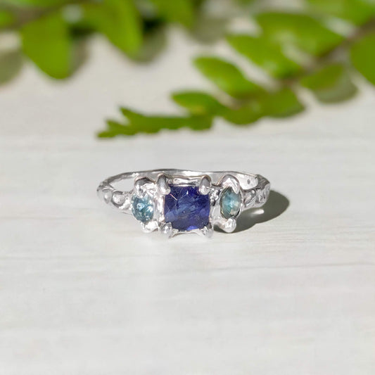 Handcrafted Blue Sapphire and Tourmaline engagement ring in solid sterling silver, featuring organic design and natural gemstones.