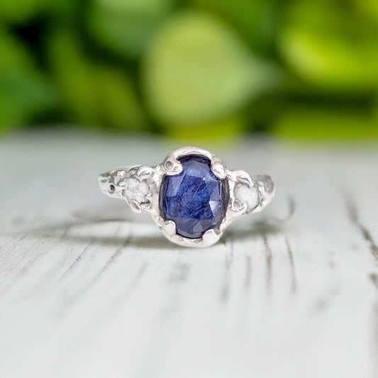 Blue sapphire and raw diamond engagement ring in solid sterling silver with nature-inspired design.