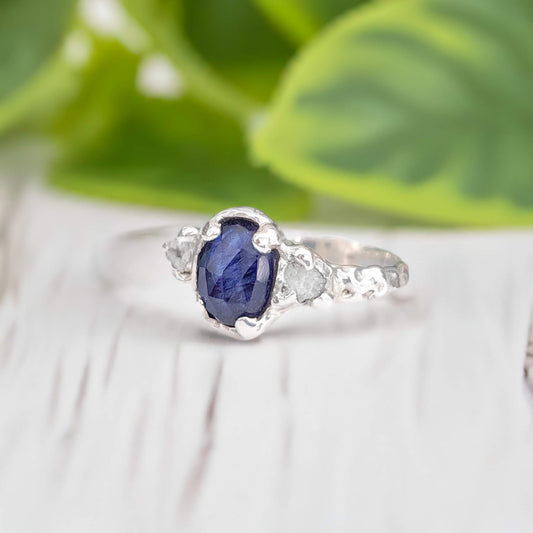 Blue sapphire and raw diamond engagement ring in sterling silver, showcasing nature-inspired design and elegant details.