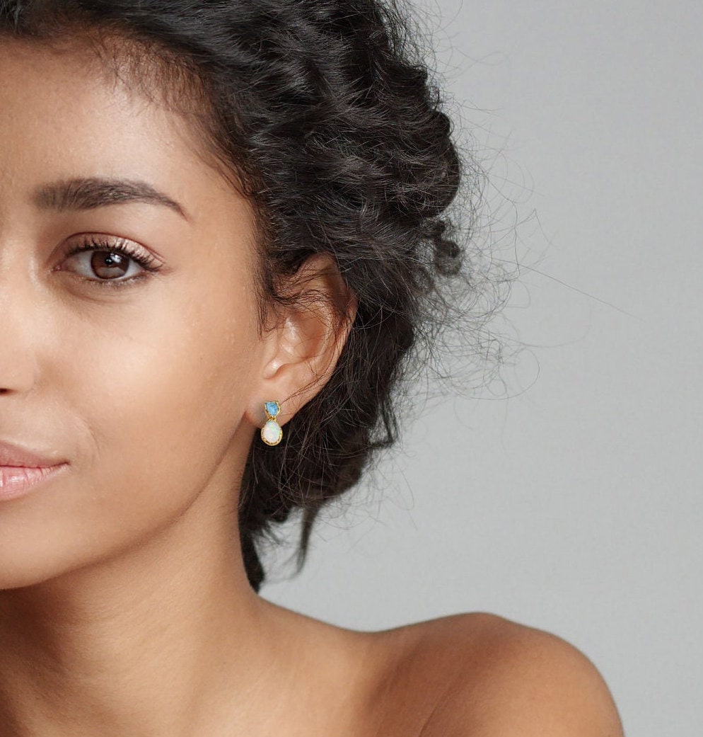 Model showcasing raw Citrine and Opal stud earrings, highlighting their unique design and elegant appeal.