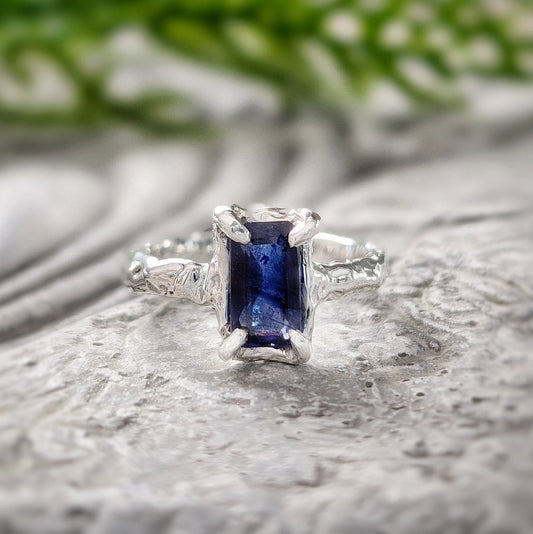 Blue Sapphire engagement ring in solid sterling silver with organic texture and emerald-shaped lab-created Sapphire.