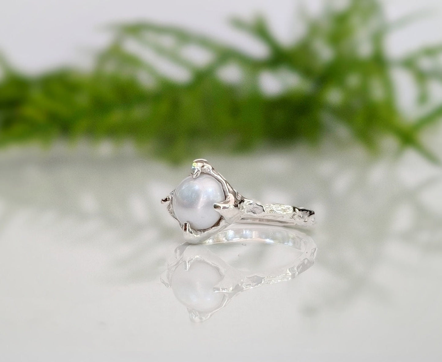 Textured sterling silver ring featuring an 8-10mm creamy-white Freshwater Keshi pearl, elegant and timeless.