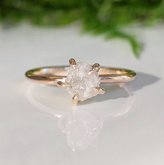 Raw diamond engagement ring set in rose gold, showcasing unique, natural beauty for a one-of-a-kind love.