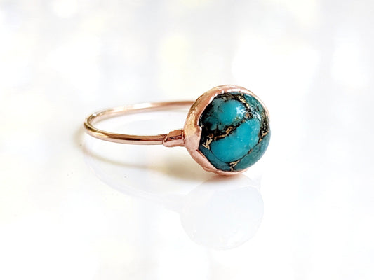 Natural 10mm turquoise ring on a gold-filled band, showcasing unique gemstone variations and handmade craftsmanship.