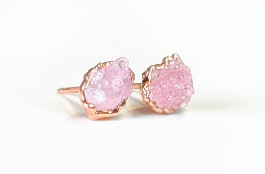 Raw Rose Quartz stud earrings on rose gold posts, embodying self-love and happiness.