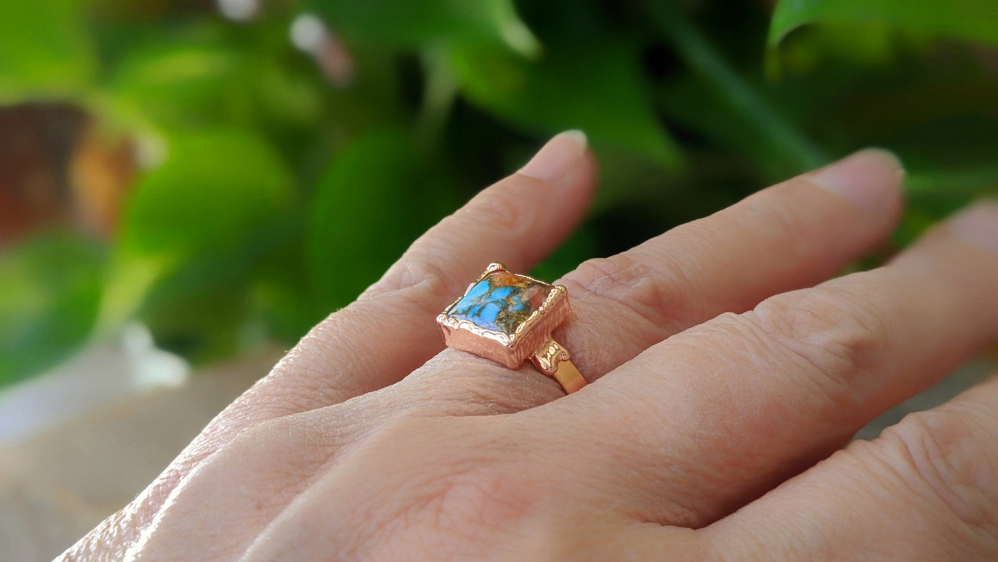 Handcrafted Pink Opal Copper Turquoise ring on a hand, showcasing the unique design and natural gemstones.