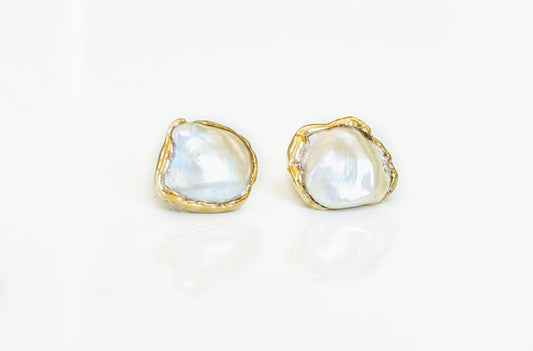 Freshwater Keshi pearl stud earrings with gold setting, perfect for everyday wear or special occasions.