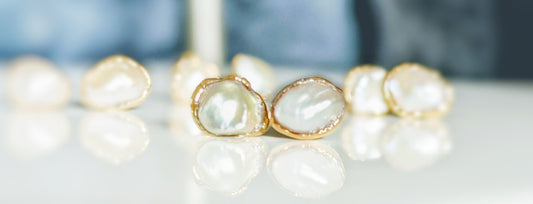 Freshwater Keshi pearl earrings in shimmering gold settings, perfect for timeless elegance and everyday wear.