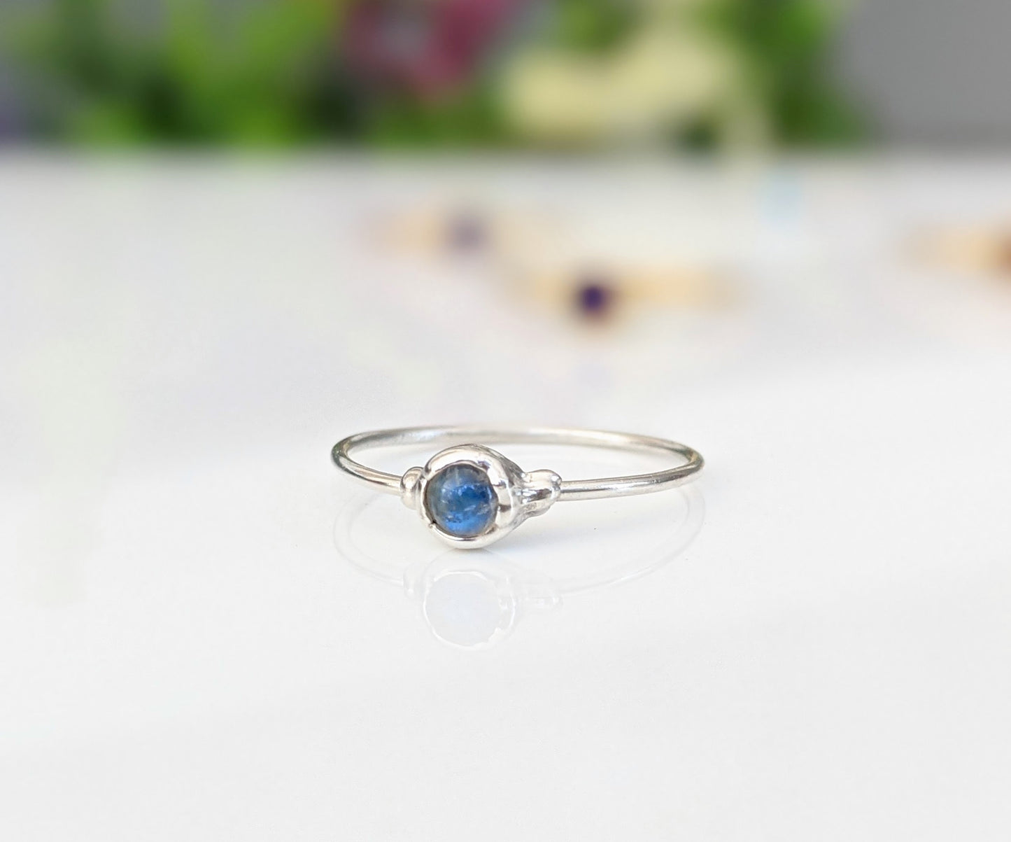 Dainty Moonstone stacking ring with 4mm natural rainbow Moonstone set on a 1.2mm Sterling Silver band.