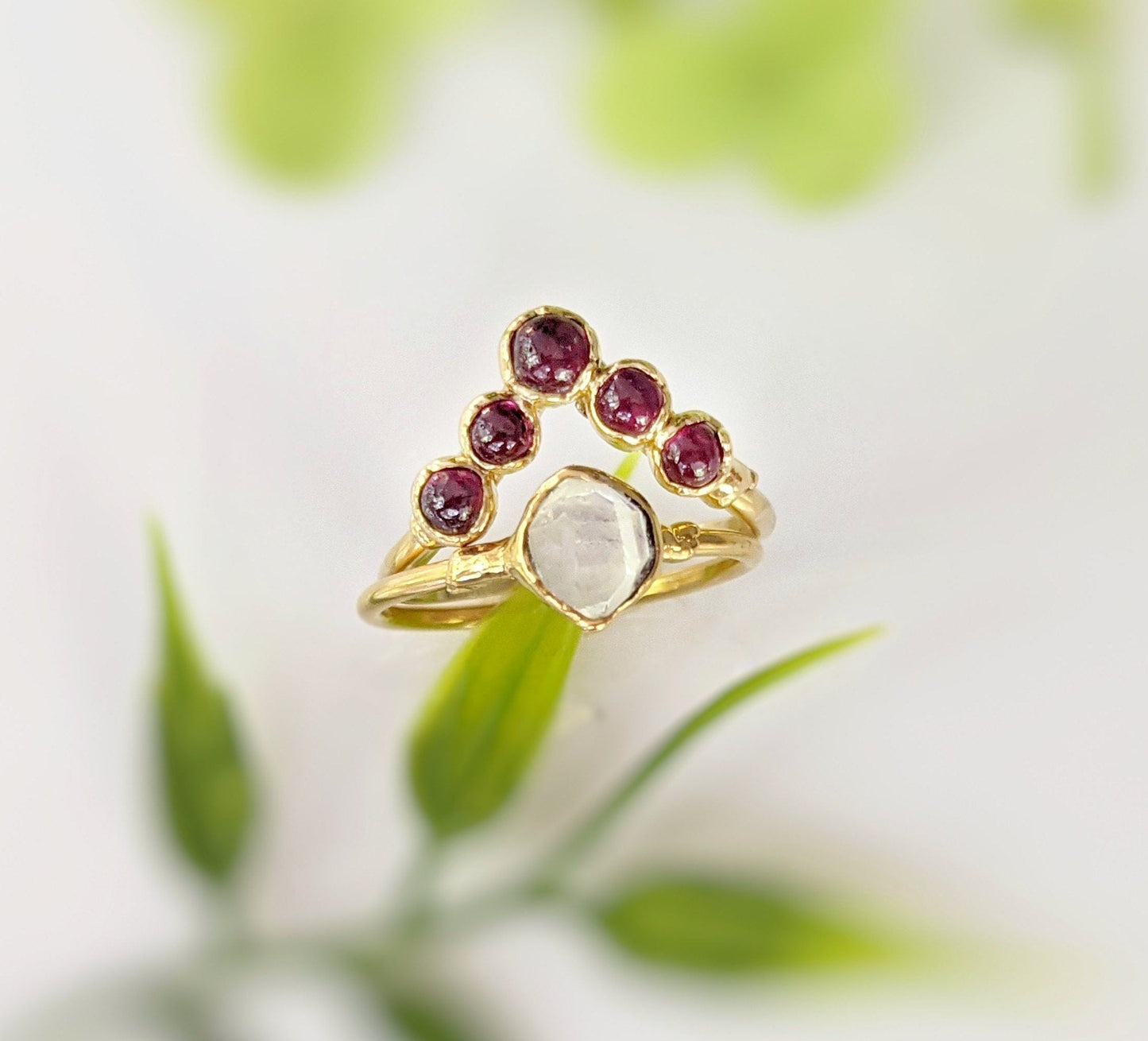 Ruby chevron ring in 18k gold featuring natural rubies and a unique design, perfect for weddings or anniversaries.