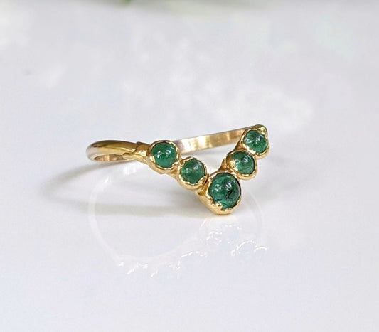 Natural Emerald Chevron wedding ring set in 18k Gold, featuring five vibrant emeralds. Perfect for love and anniversaries.