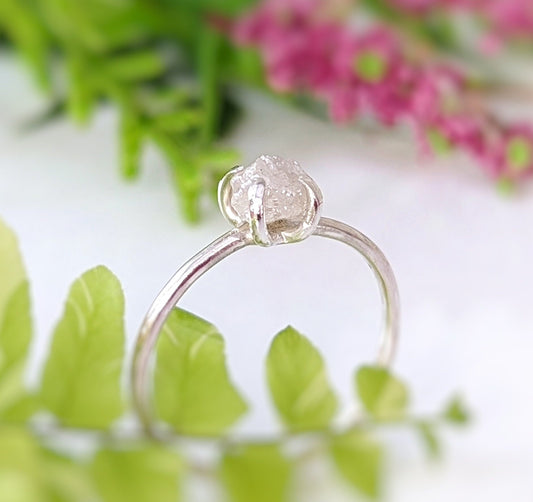 Delicate sterling silver raw diamond engagement ring featuring a unique conflict-free diamond, perfect for timeless moments.