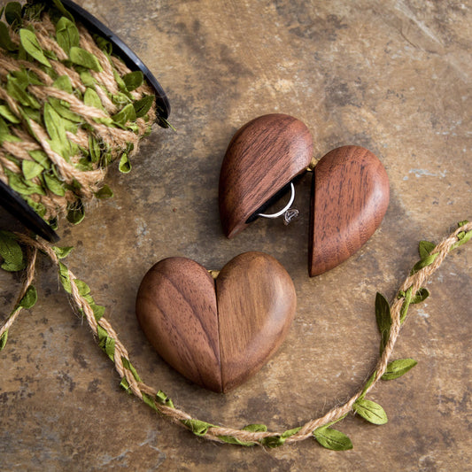 Heart-shaped wooden ring box for engagement or wedding rings, featuring a unique design and intricate details.