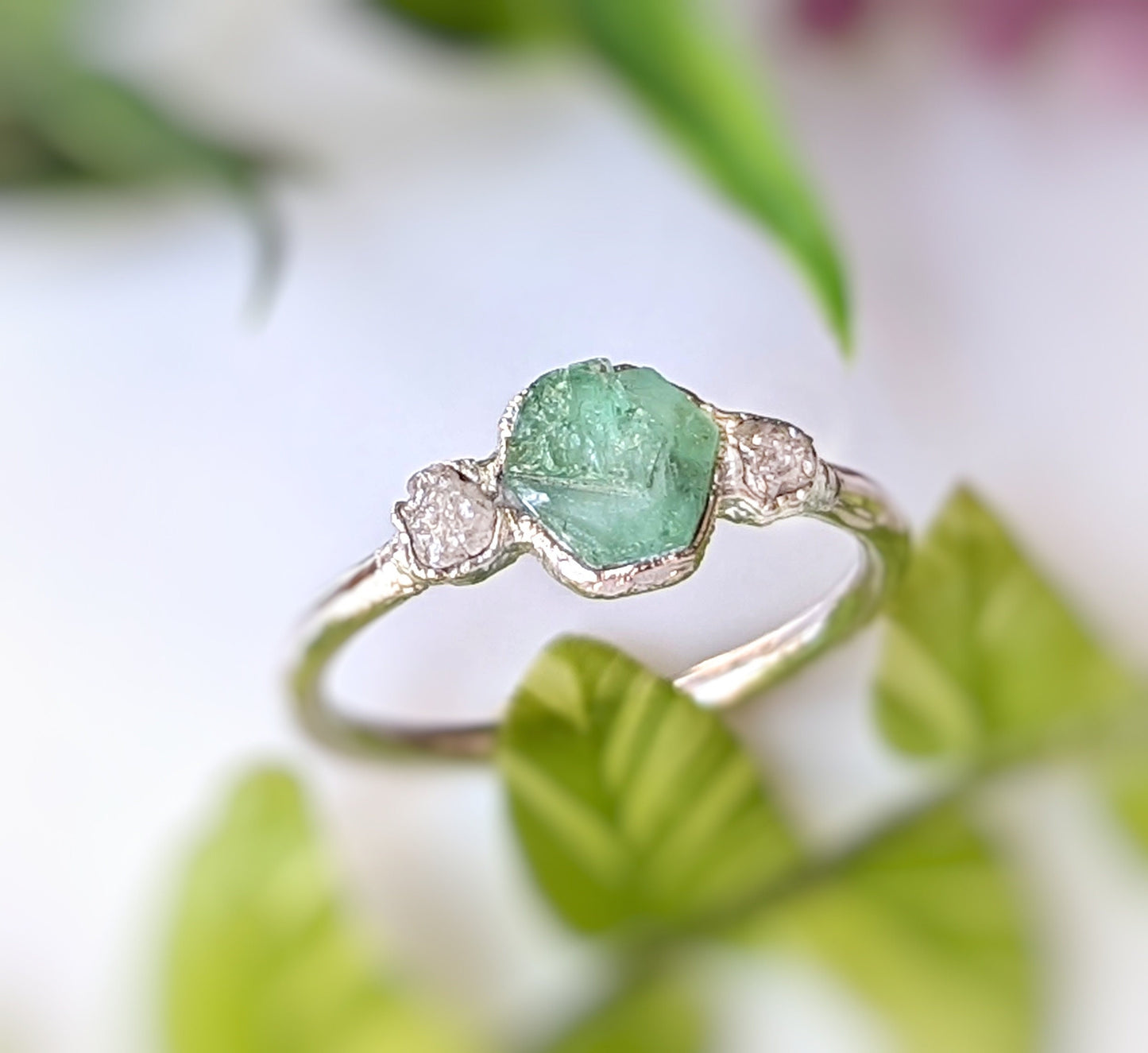 Raw emerald and rough diamond ring, handcrafted with rustic elegance, perfect for engagements or special occasions.