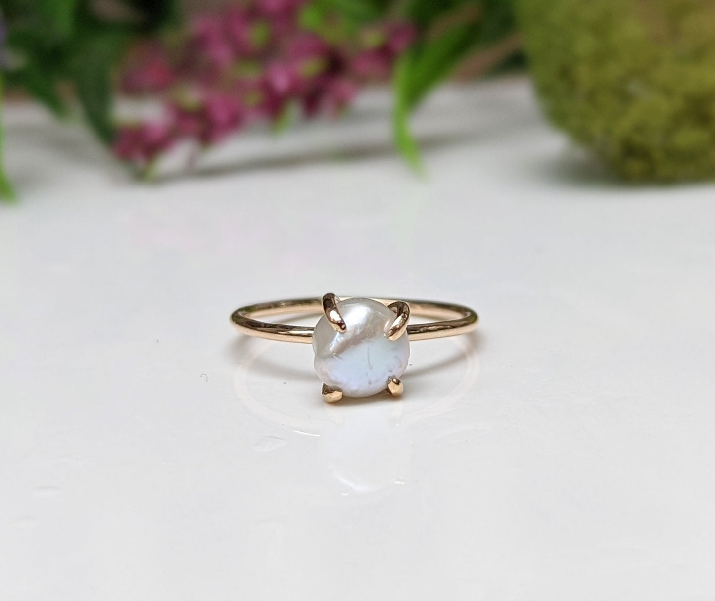 Handcrafted freshwater Keshi pearl solitaire ring in 18k gold, showcasing unique beauty and elegance.