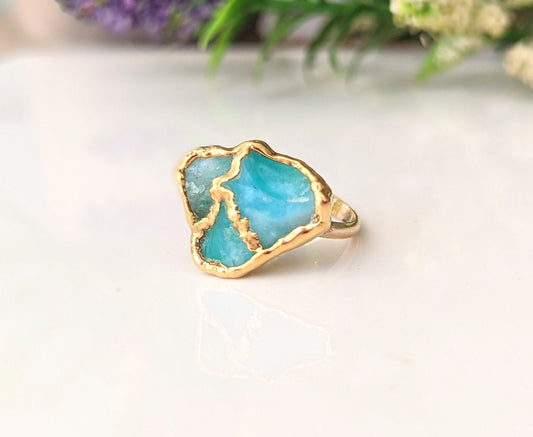 Unique Aqua blue raw Peruvian Opal Kintsugi ring on a gold band, perfect for special occasions.