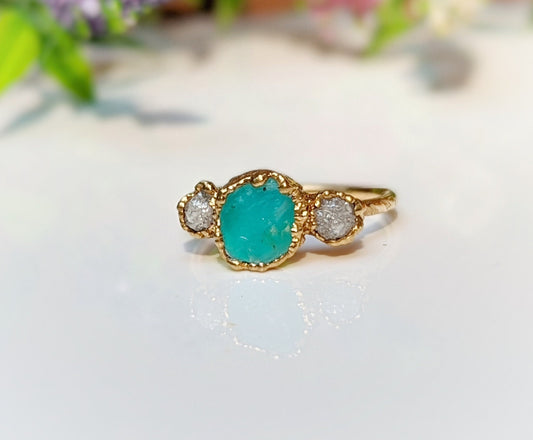 Raw Peruvian Opal and diamond ring in solid 14k gold, showcasing a vibrant blue-green opal with two diamonds.