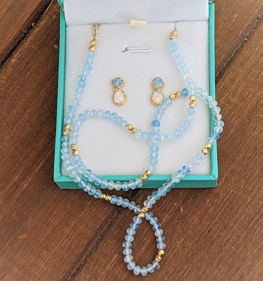 Aquamarine and Opal bridal jewelry set in display box, featuring stud earrings and a bead necklace.