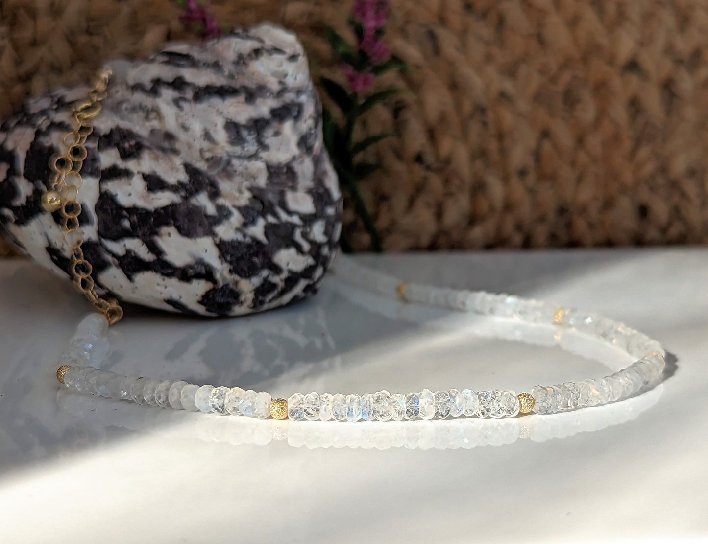 Rainbow Moonstone faceted beaded necklace highlighting shimmering beads, ideal for gifts and bridal occasions.