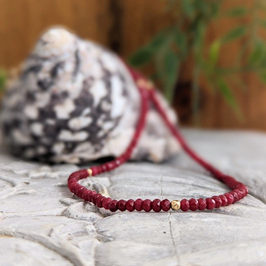 Handmade ruby beaded necklace featuring dark pink natural Ruby beads and a gold accent, perfect for gifts or bridal wear.