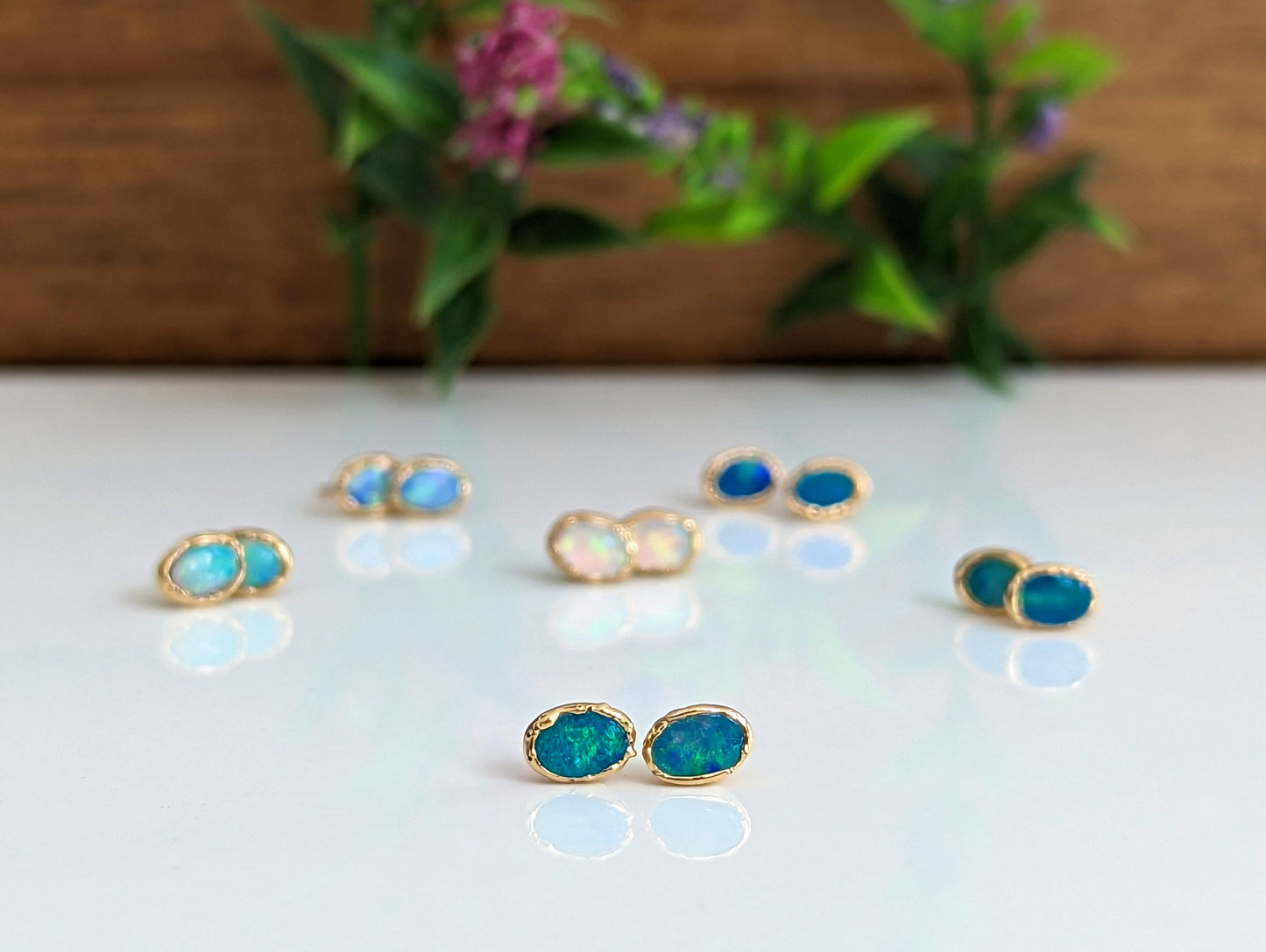 Handcrafted Blue Australian Opal stud earrings in 18k Gold, elegant gemstone jewelry. Perfect Mother's Day gift.