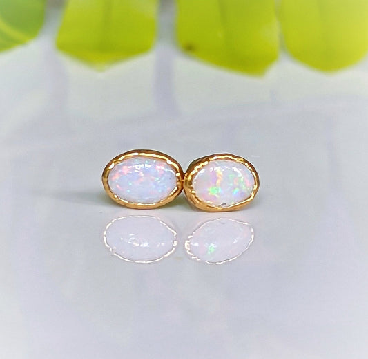 Elegant white Australian Opal stud earrings set in 18k gold, perfect for bridal and special occasions.