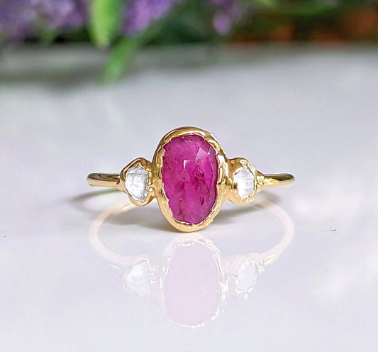 Rubellite Tourmaline engagement ring with Herkimer diamonds on a 14k gold band.