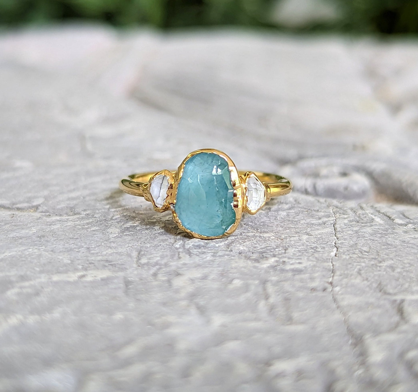 Aqua blue Grandidierite and diamond ring in 18k Gold, showcasing unique handcrafted design.