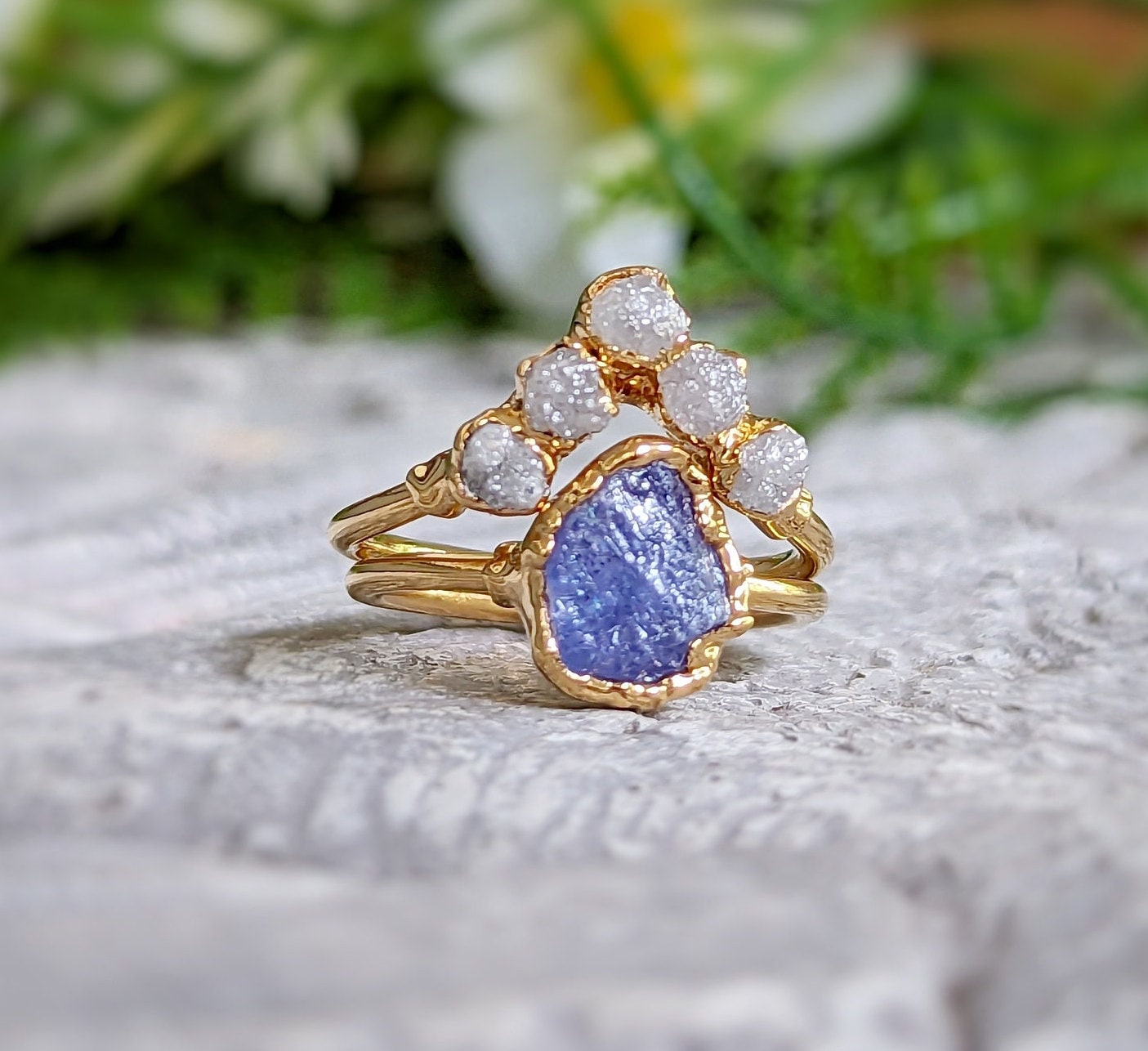 Raw Tanzanite and diamond Chevron wedding ring set on a gold band, showcasing a unique and eye-catching design.