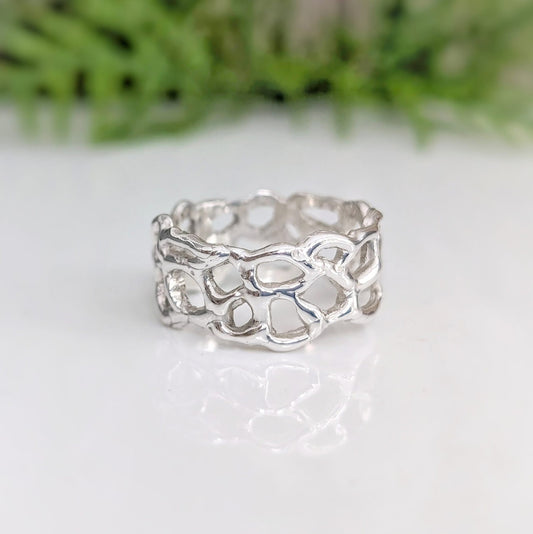 Molten Silver Honeycomb ring showcasing an abstract, nature-inspired design in solid sterling silver.