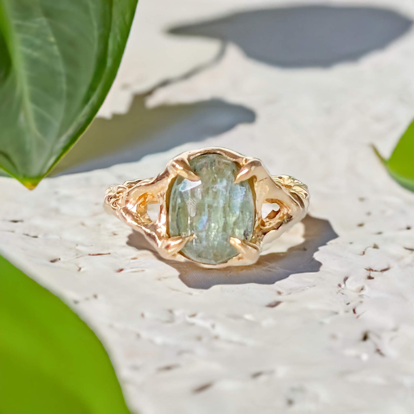 Solid gold textured Green Kyanite ring with an oval rose cut stone, showcasing unique artisanal design.