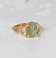 Solid 14k Gold textured ring featuring an oval-shaped green Kyanite gemstone on a unique organic band.