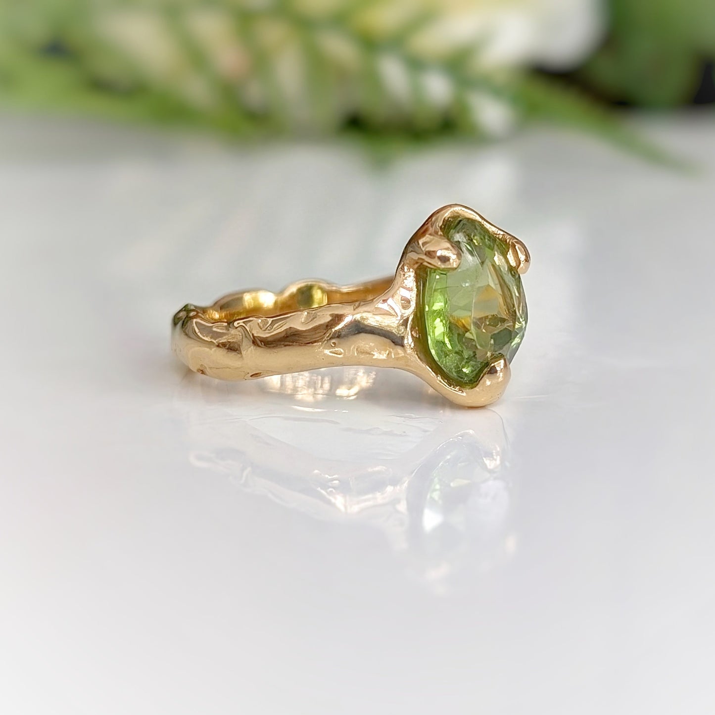 Pear shape Peridot set on a Molten Silver textured band