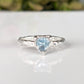 Trilliant shape Aquamarine set by prongs in organic Solid Sterling Silver band