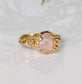 Handcrafted pink Morganite ring in solid 14k gold, featuring oval rose cut gemstone and textured band.