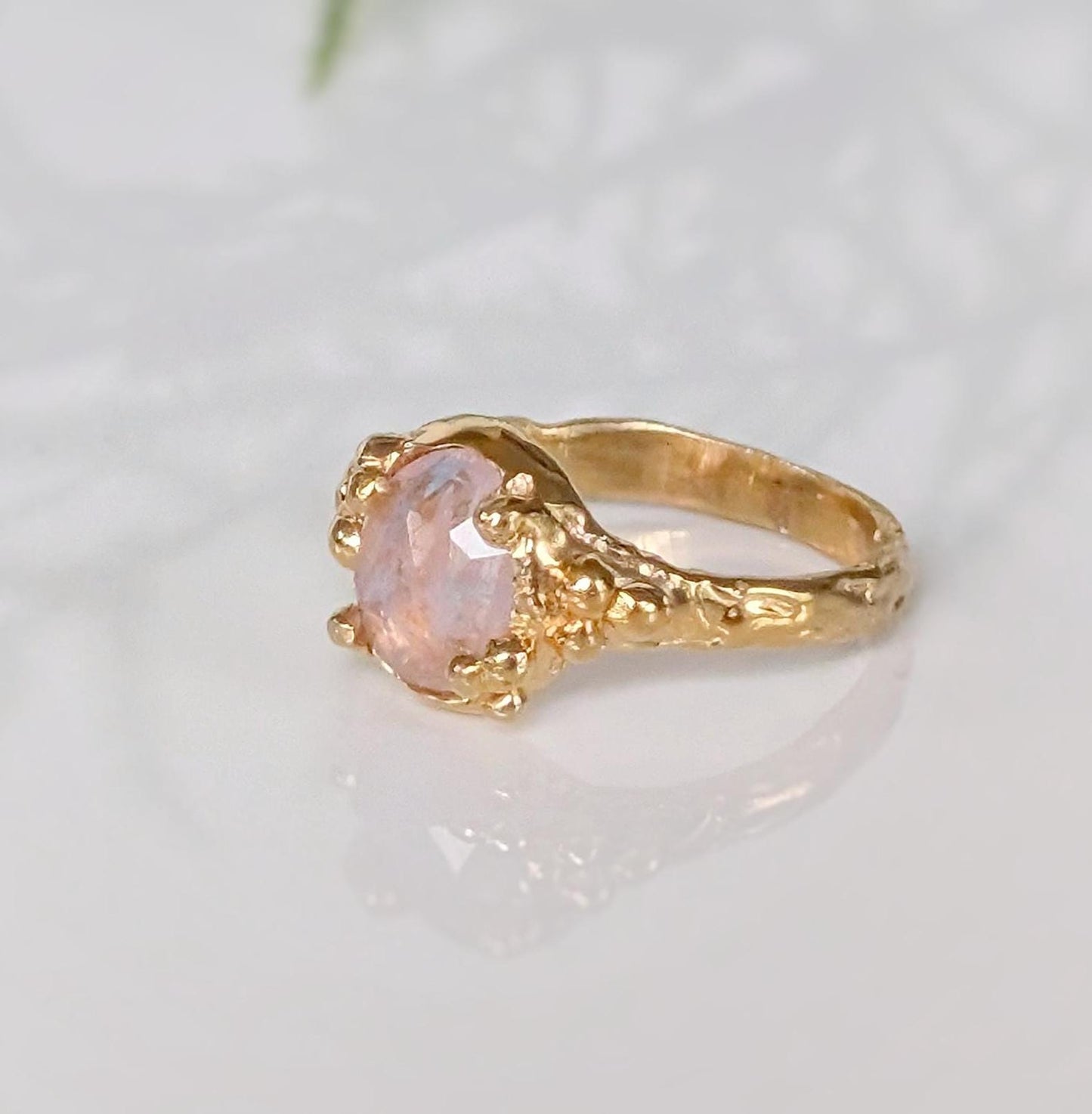 Handcrafted Pink Morganite ring in Solid 14k Gold with a textured band and oval rose cut gem.
