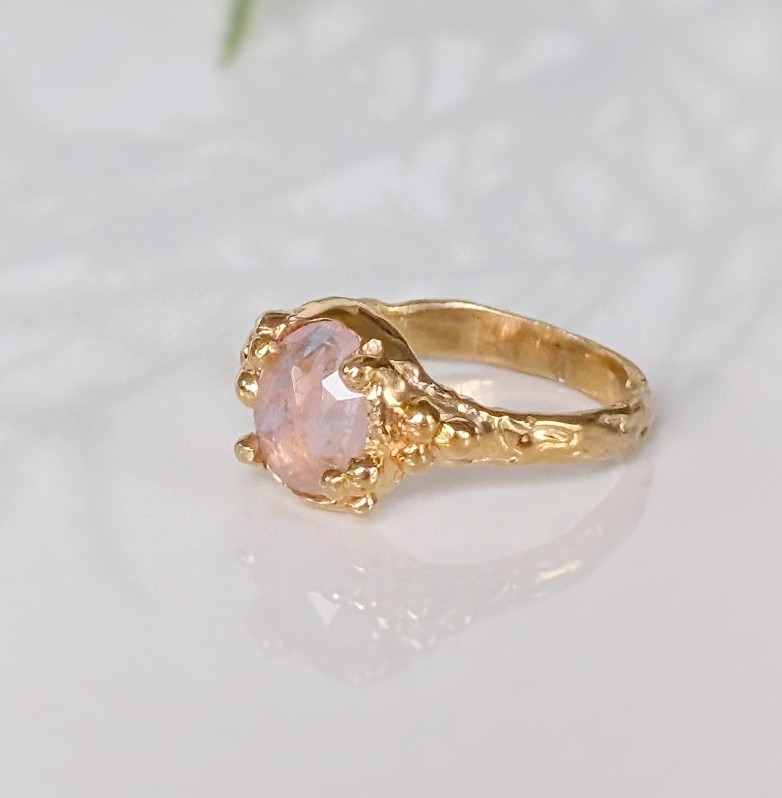 Handcrafted Pink Morganite ring in Solid 14k Gold with a textured band and oval rose cut gem.