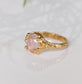Handcrafted Pink Morganite ring in Solid 14k Gold with a textured band and oval rose cut gem.