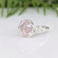 Elegant pink Morganite ring in solid silver with floral detailing, showcasing a rose cut gemstone.